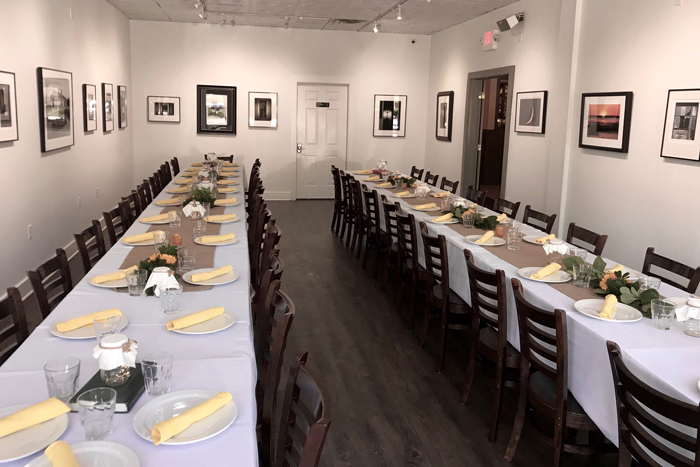 Dining room for large groups, framed pictures on the walls